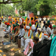 Farmers discussing the new farm laws outside the parliament on July 22.